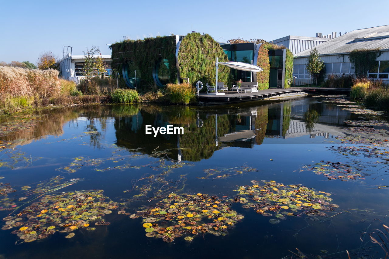 SCENIC VIEW OF LAKE AGAINST BUILDINGS