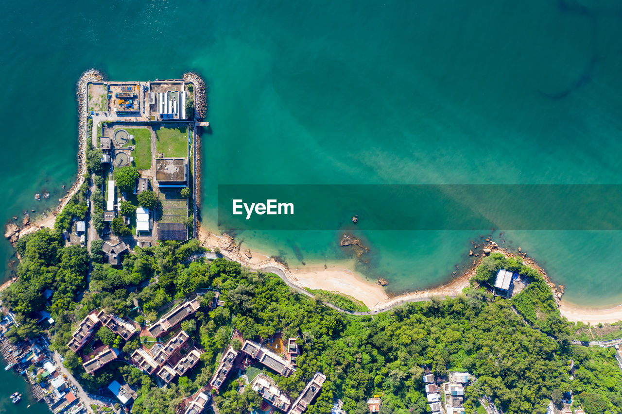 Aerial view of townscape by sea