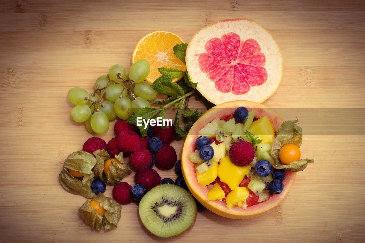 Directly above shot of various fruits on wooden table