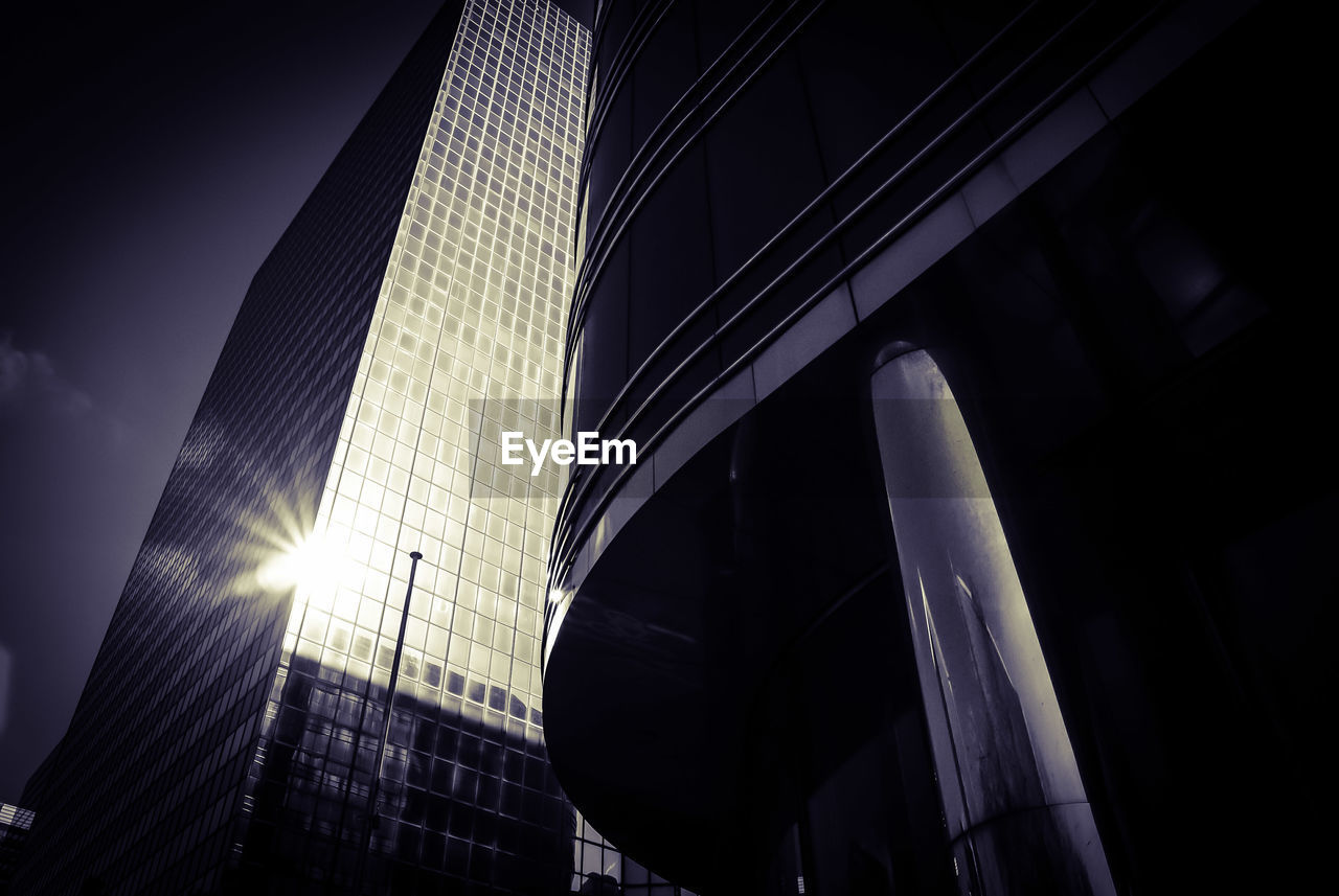 Low angle view of modern building against sky in city