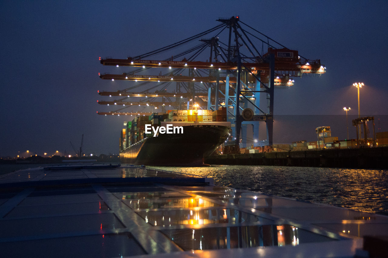 Cranes loading container ship