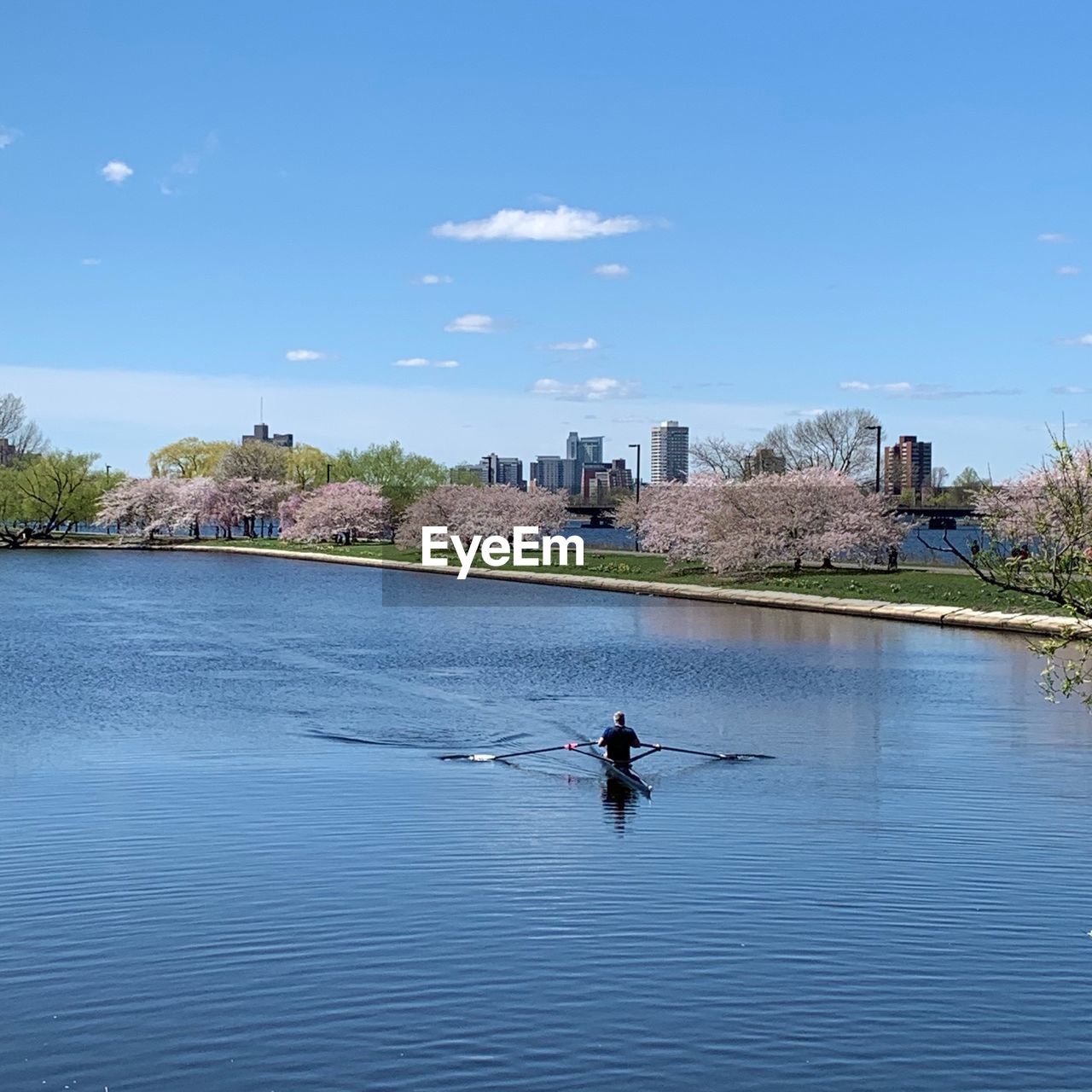 MAN ON RIVER AGAINST SKY