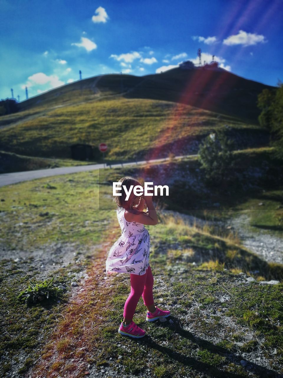 High angle view of girl standing on field