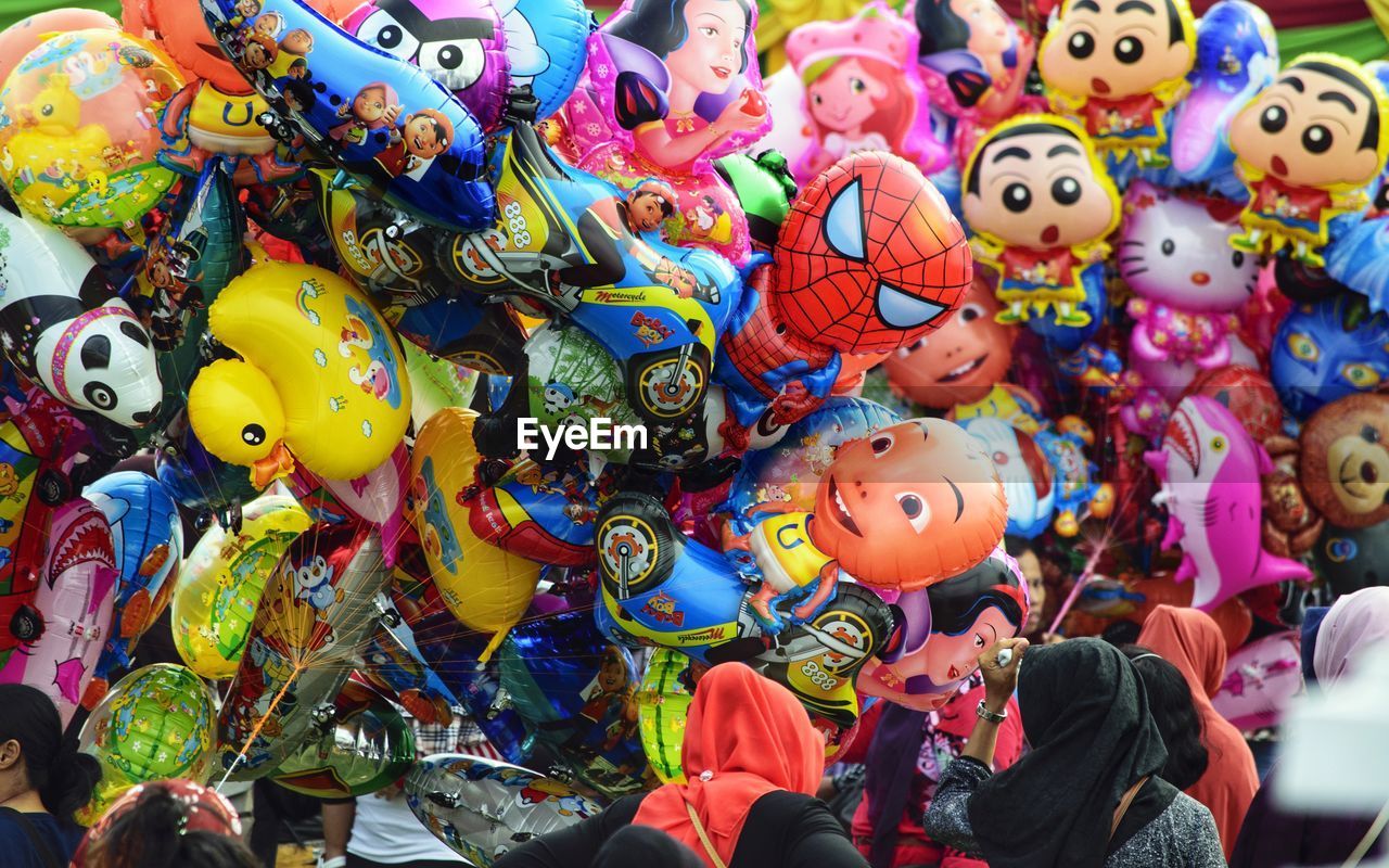 Colorful toys for sale at market stall