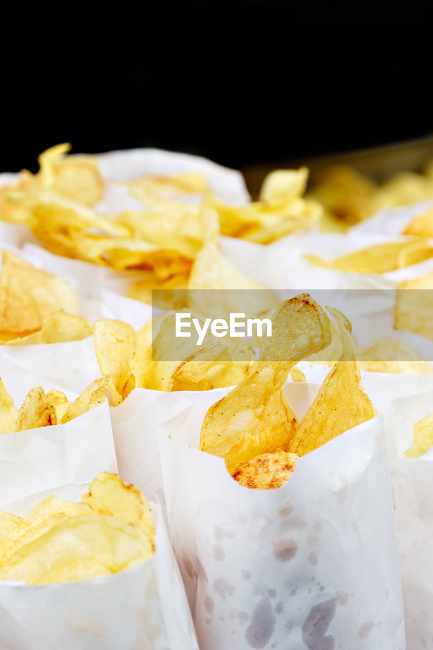 Traditional potato chips on a craftsman image.