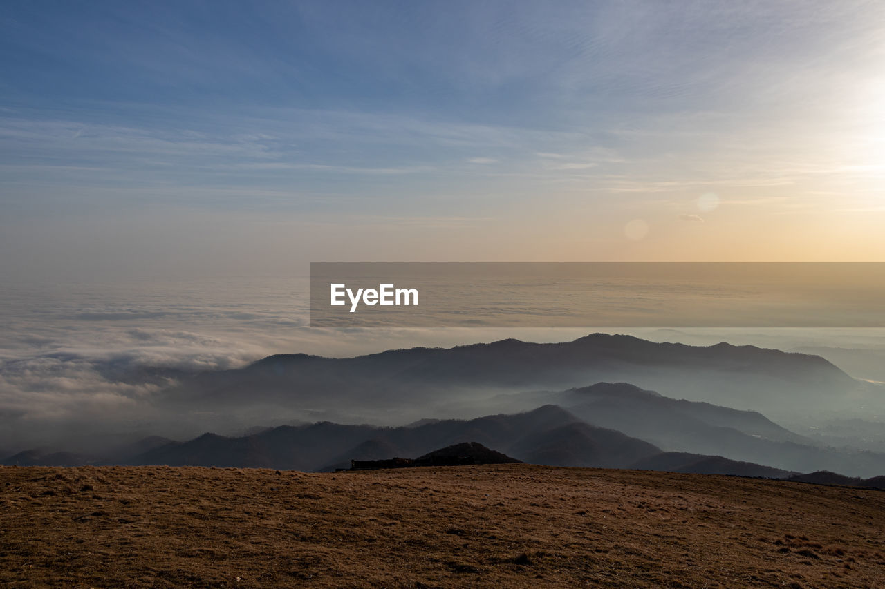 Panoramic view of fog on the hills from mountain