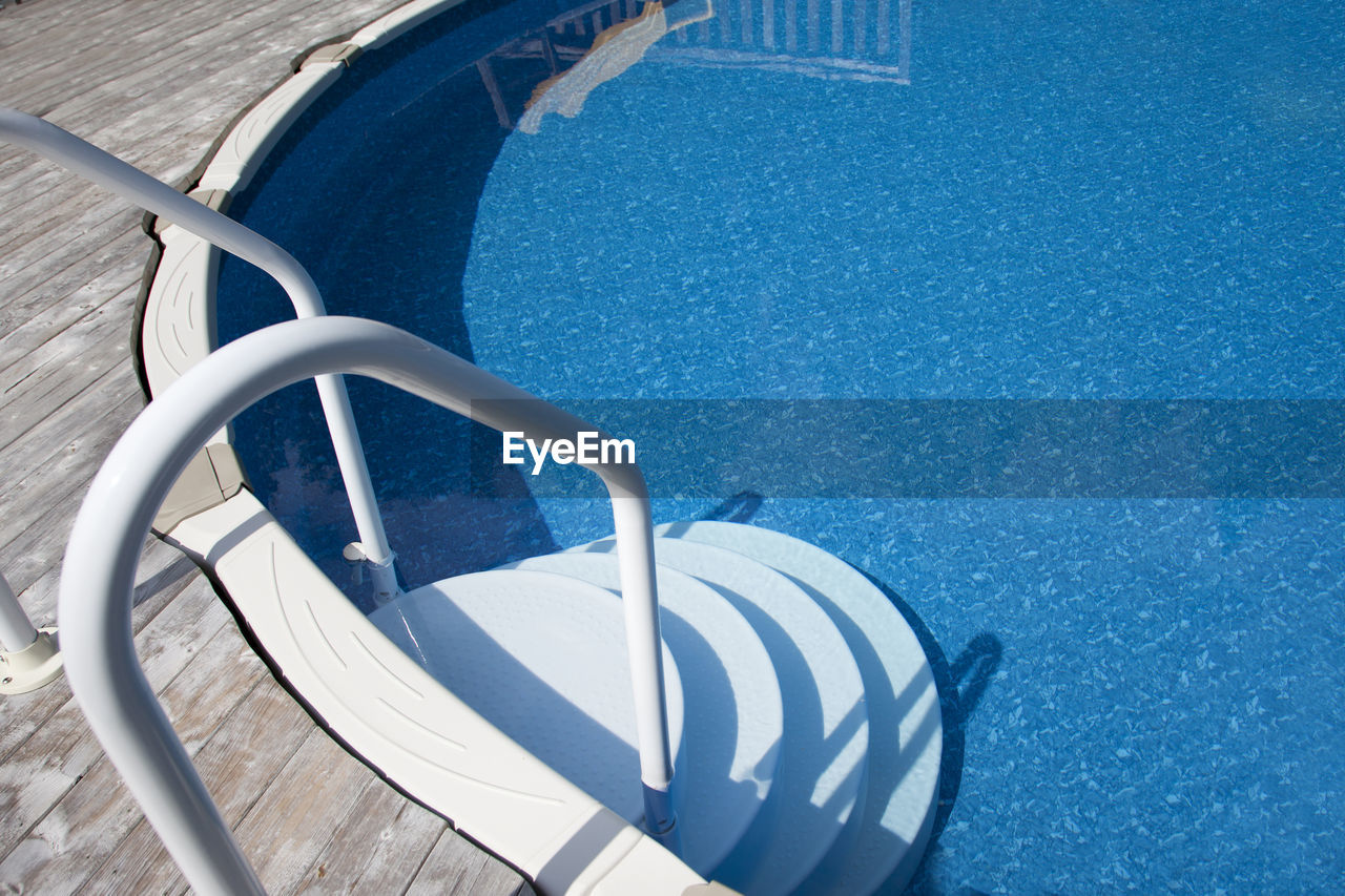 HIGH ANGLE VIEW OF SWIMMING POOL IN WATER