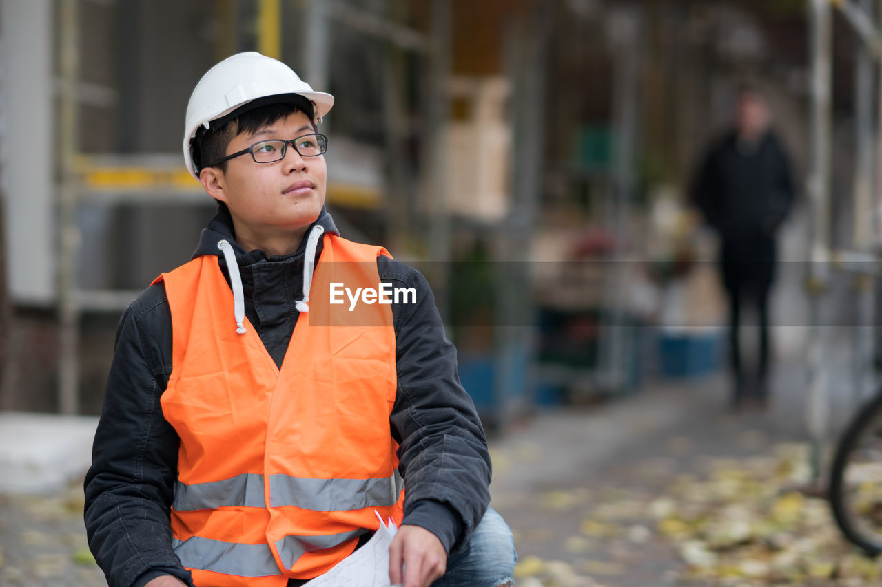 Portrait of engineer in reflective clothing outdoors