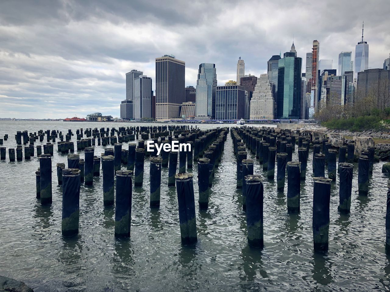 Panoramic view of sea and buildings against sky