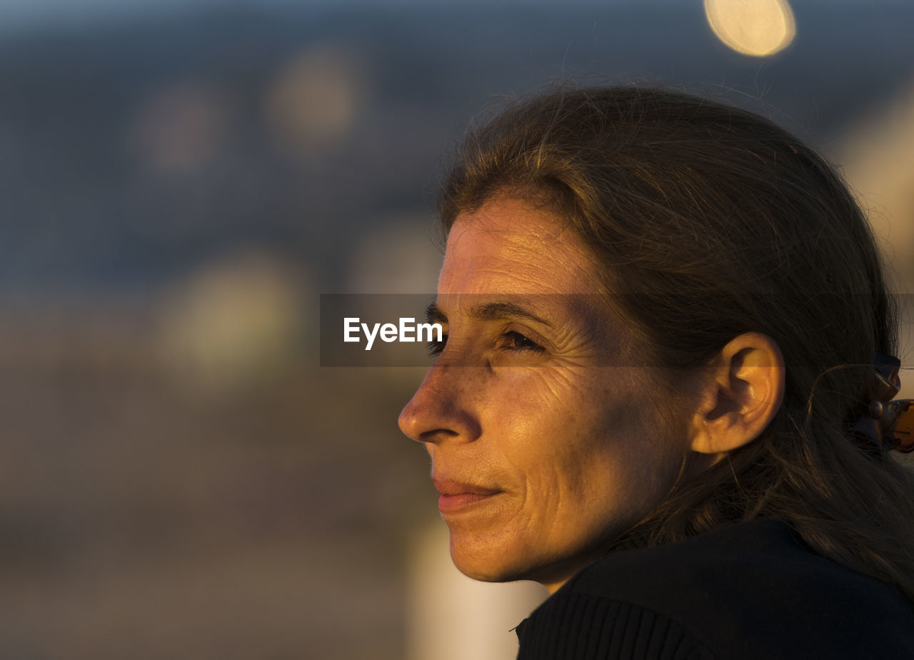 Close-up of woman looking away