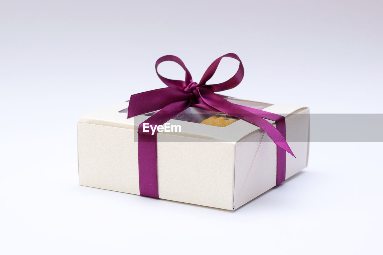 Close-up of gift box against white background