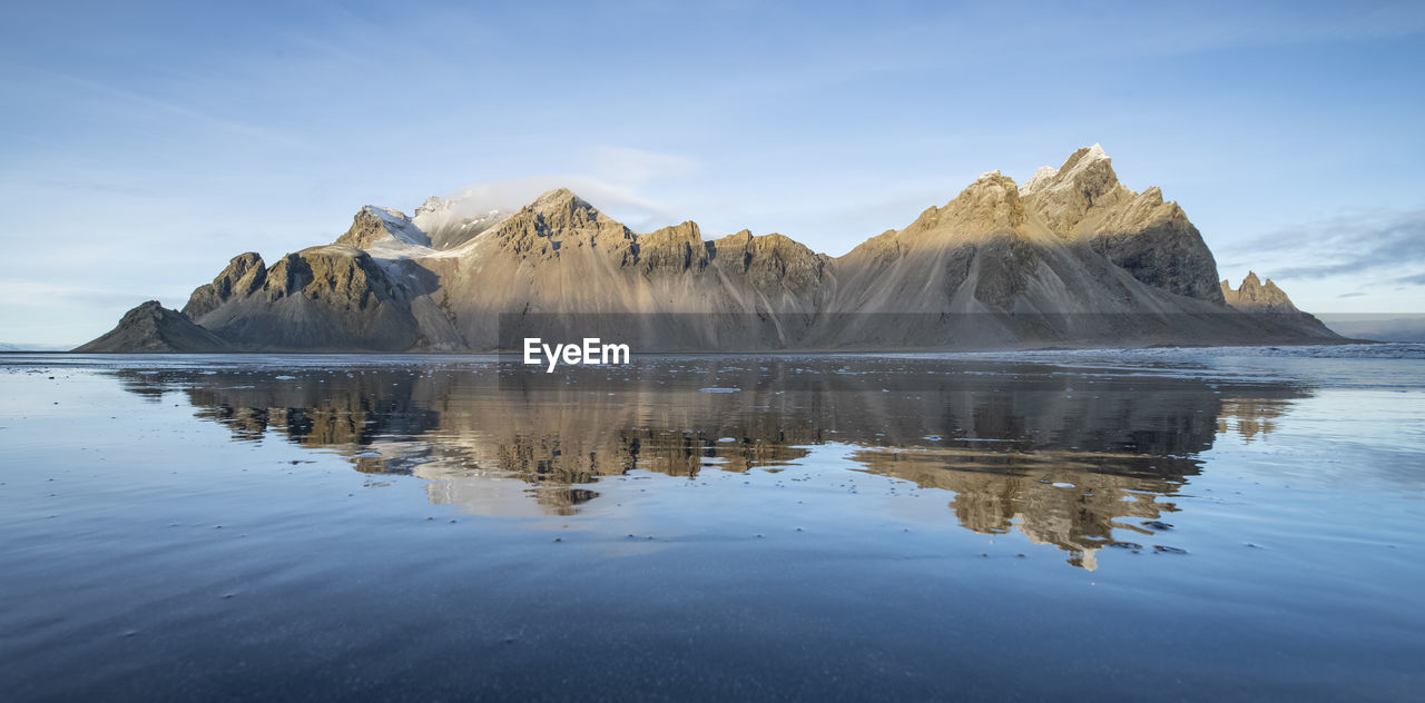 Panoramic view of lake and mountains against sky