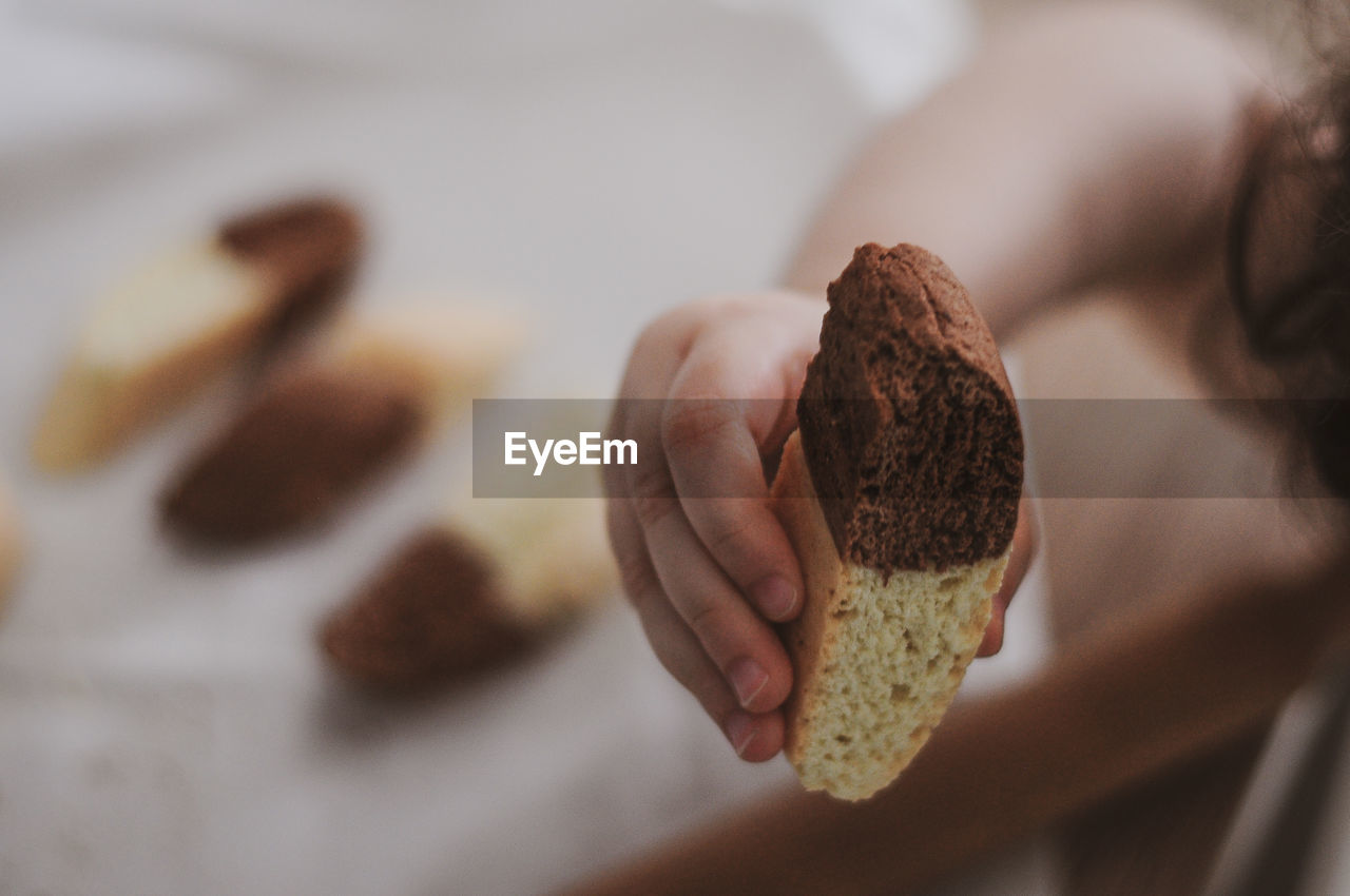 Close-up of hand holding sweet food