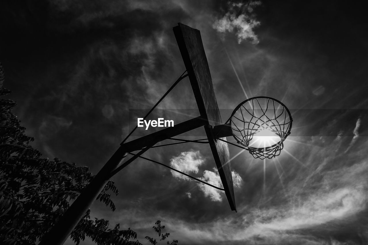 Low angle view of silhouette tree against sky