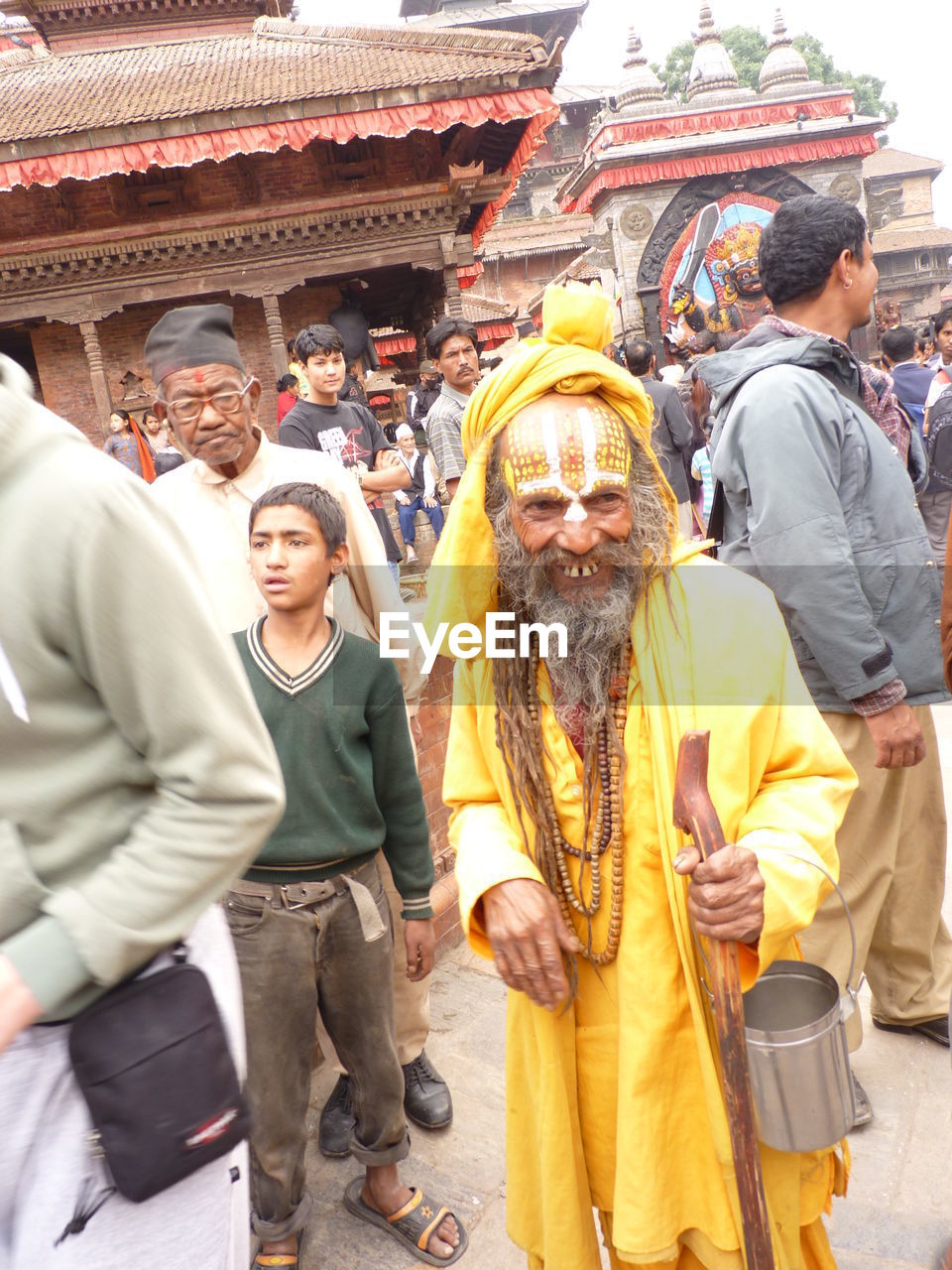 REAR VIEW OF PEOPLE ON TEMPLE