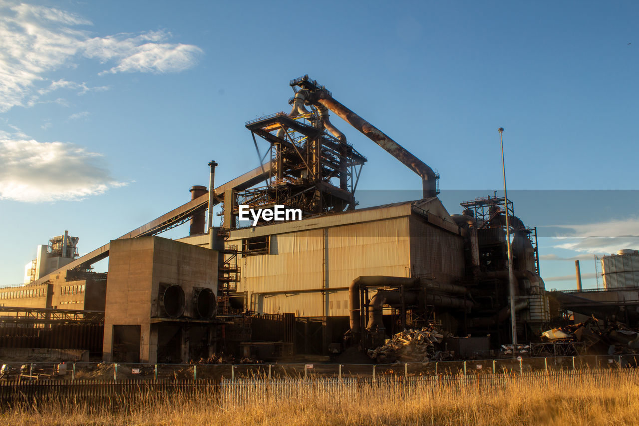 industry, sky, transport, machinery, nature, business, architecture, cloud, business finance and industry, transportation, power generation, day, outdoors, vehicle, factory, no people, blue, equipment, plant, landscape