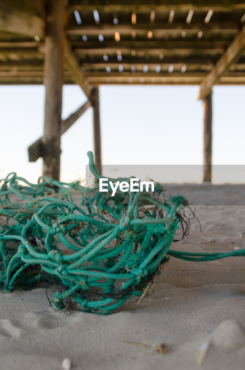 CLOSE-UP OF FISHING NET IN WATER