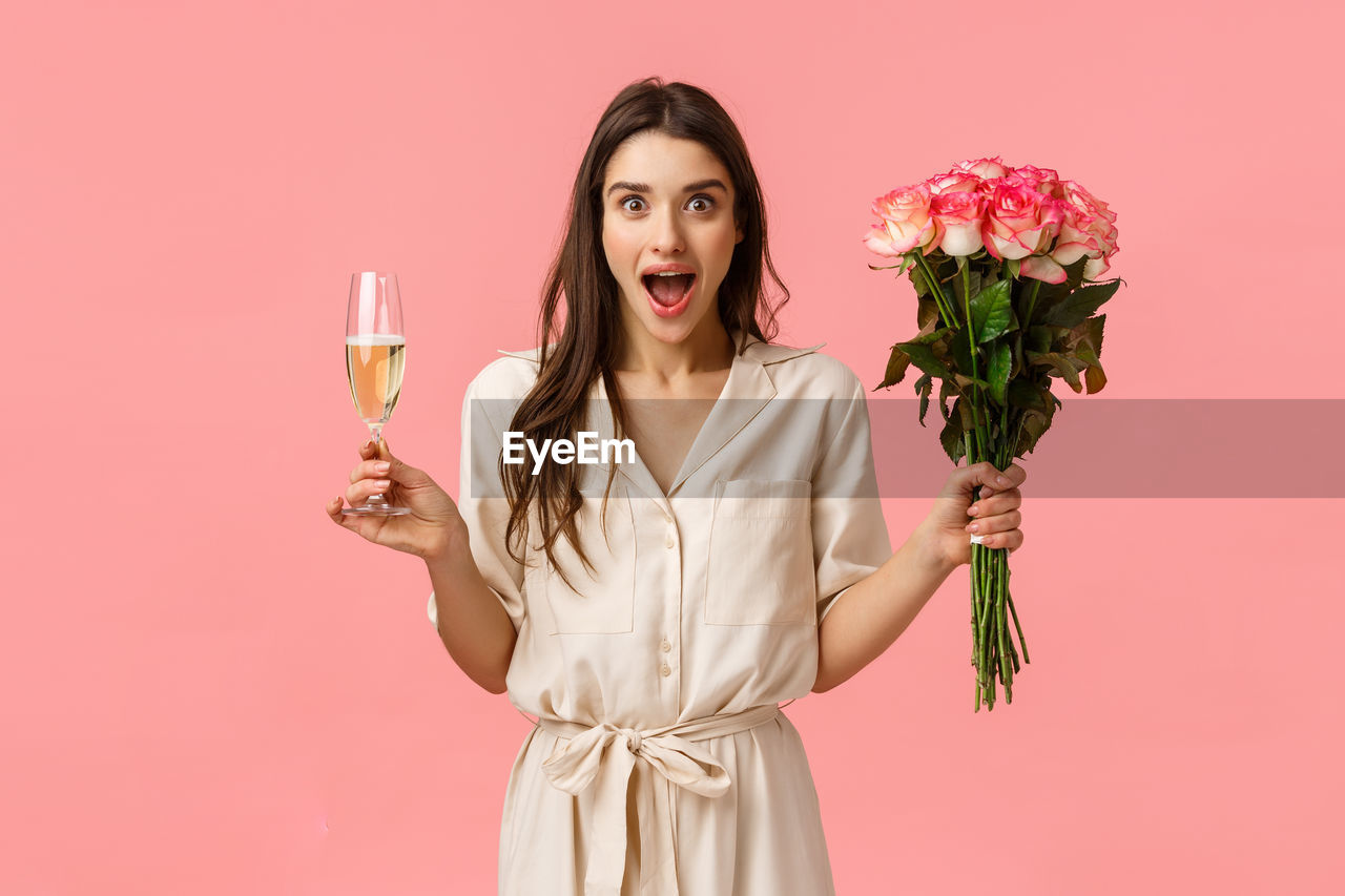 PORTRAIT OF WOMAN WITH PINK ROSES