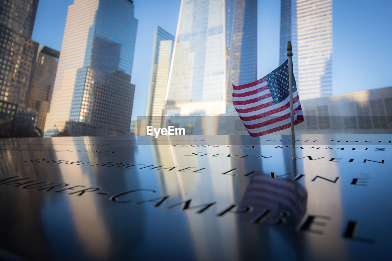 Low angle view of flags in city