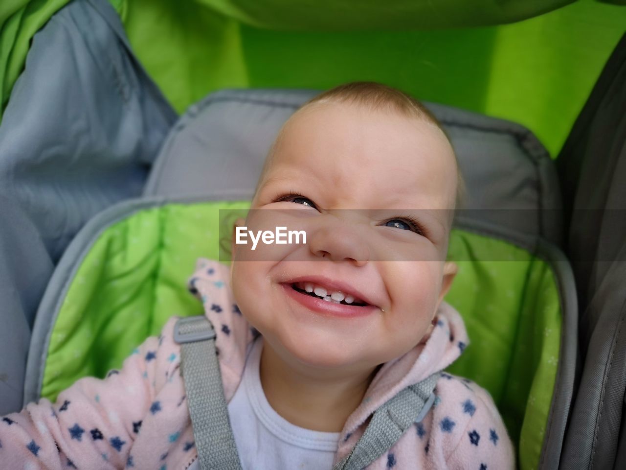 High angle portrait of smiling girl in stroller