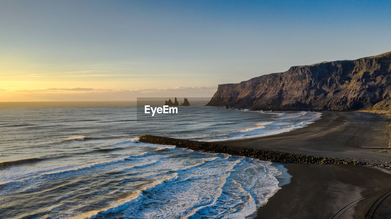 PANORAMIC VIEW OF SEA AGAINST SKY DURING SUNSET