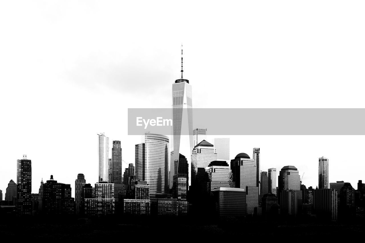 SKYSCRAPERS IN CITY AGAINST SKY