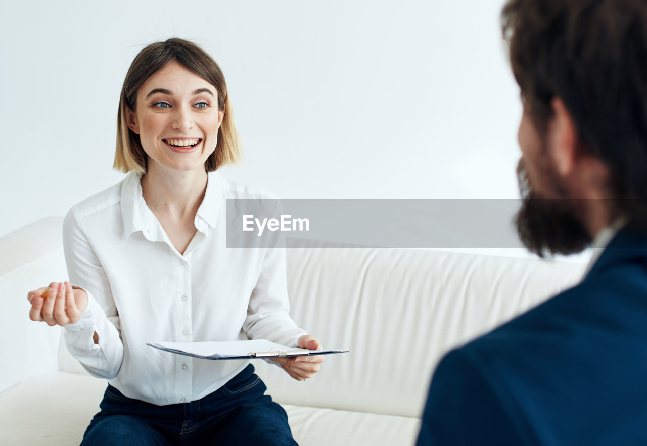 side view of female doctor examining patient