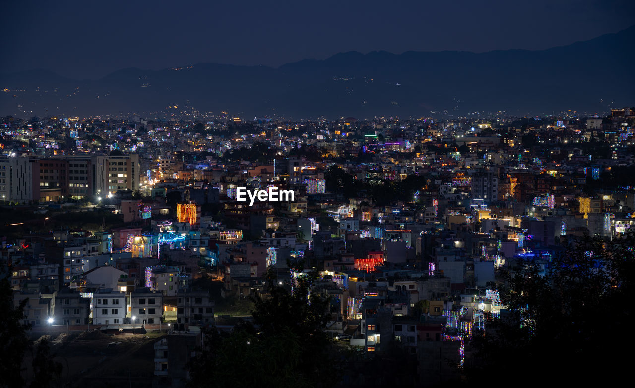 high angle view of illuminated cityscape at night