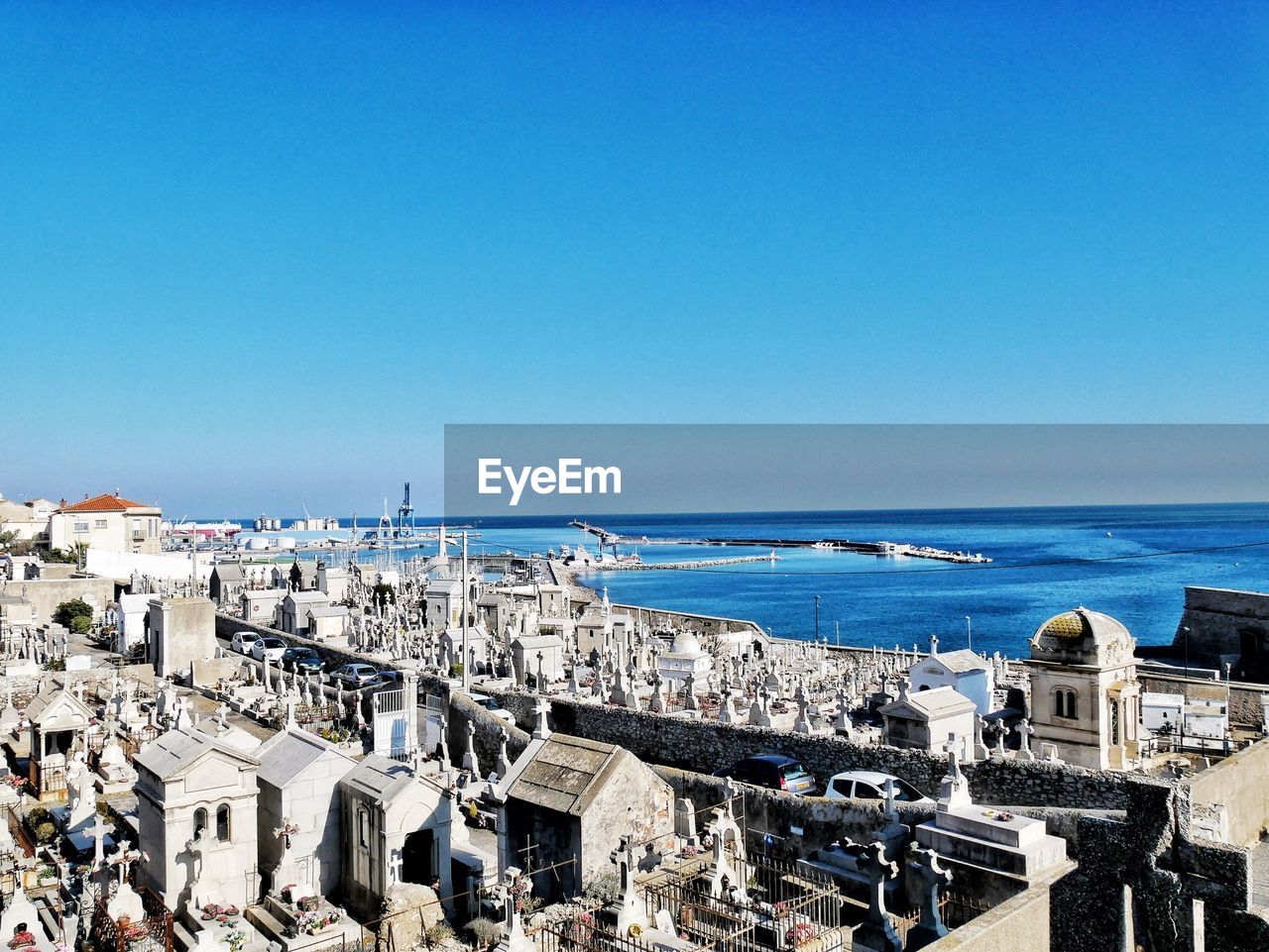 High angle view of cityscape against clear blue sky