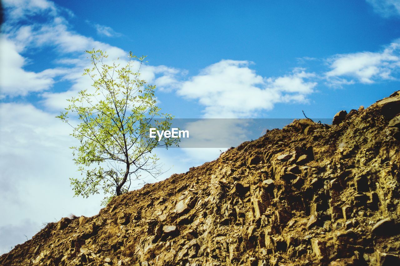 Low angle view of rocks against sky