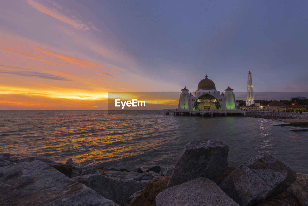 Scenic view of sea at sunset