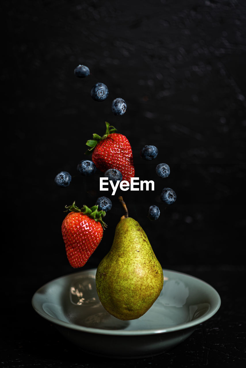 fruit, healthy eating, food and drink, food, berry, wellbeing, still life photography, freshness, black background, strawberry, studio shot, produce, plant, pear, no people, indoors, still life, ripe, painting, juicy, organic, antioxidant, blueberry, red, copy space
