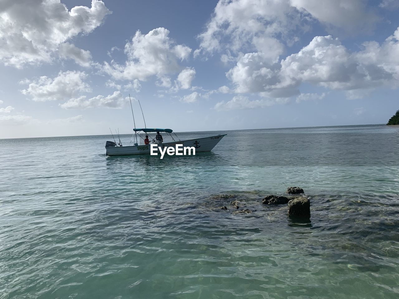 Scenic view of sailboat in sea against sky