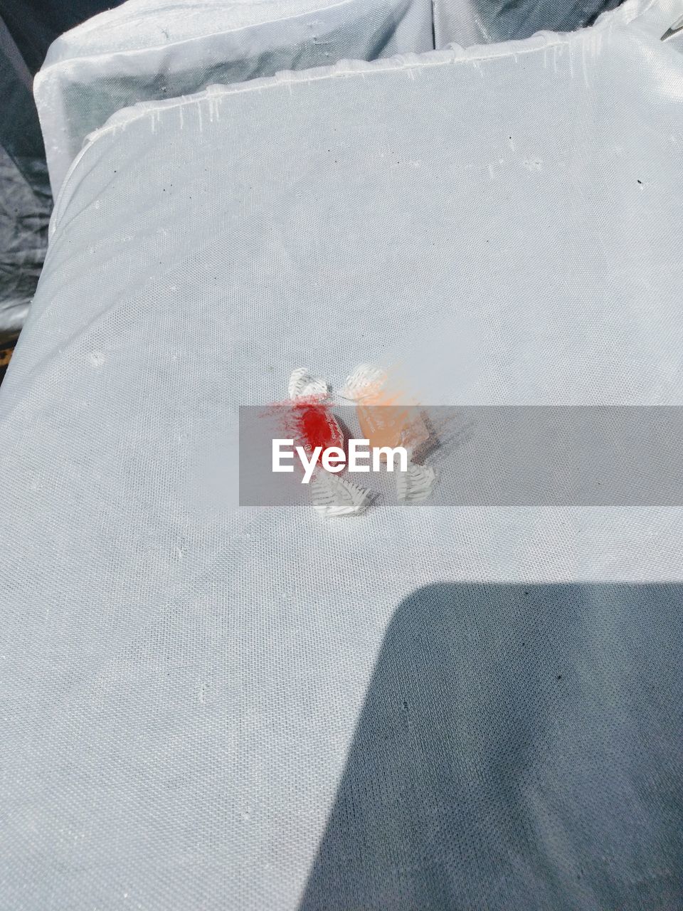 HIGH ANGLE VIEW OF ICE CREAM ON FROZEN WATER