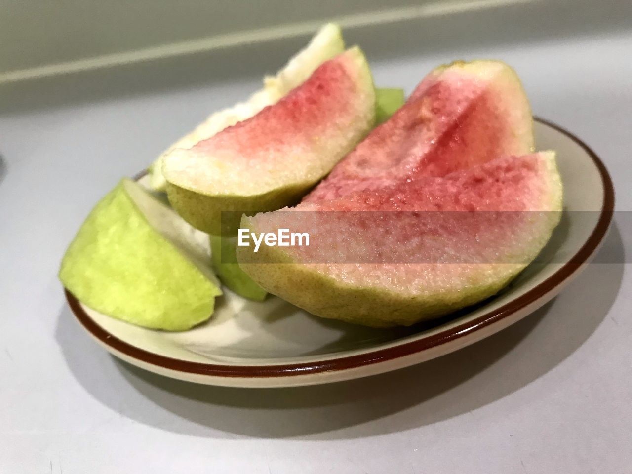 High angle view of chopped slices in plate on table