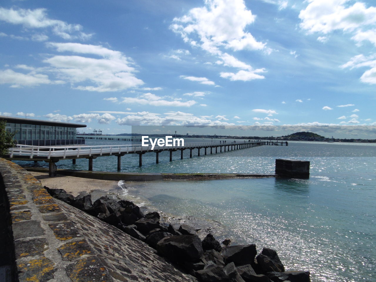 Pier over sea against sky