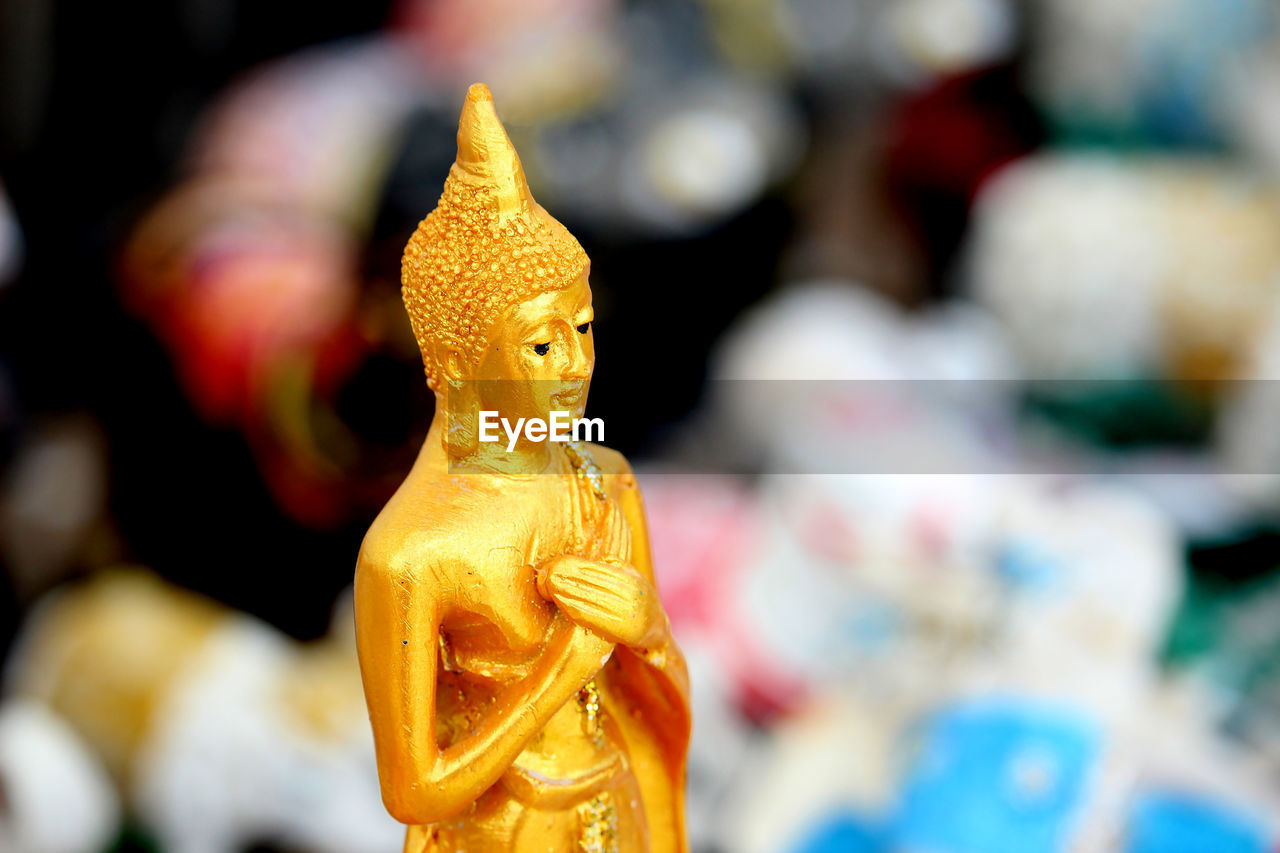 Close-up of buddha statue at temple