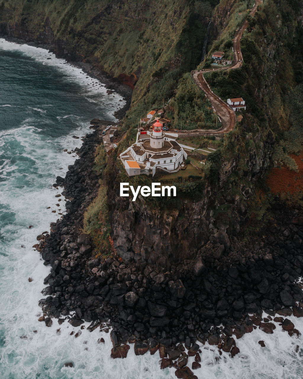 High angle view of rocks on sea shore