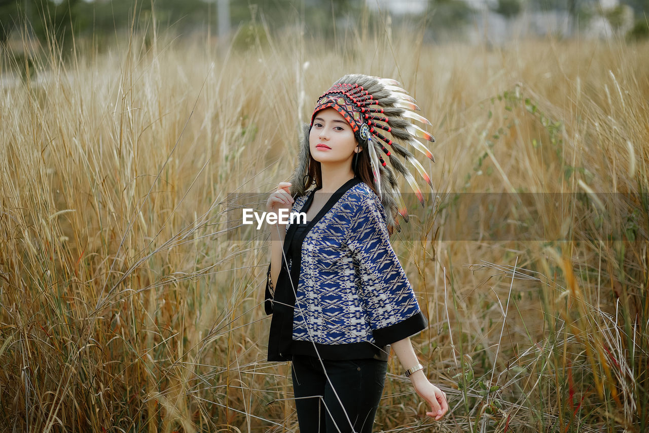 Young woman standing on field