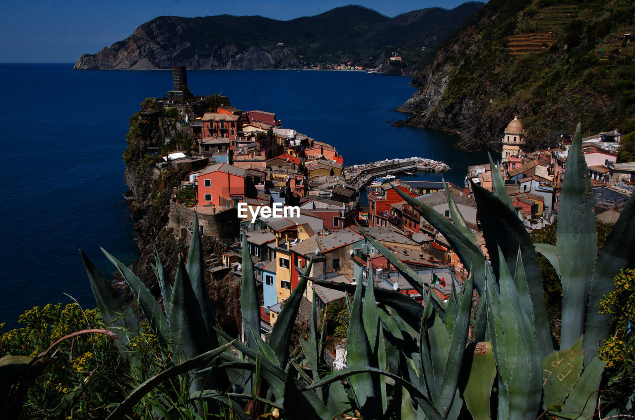 High angle view of townscape by sea
