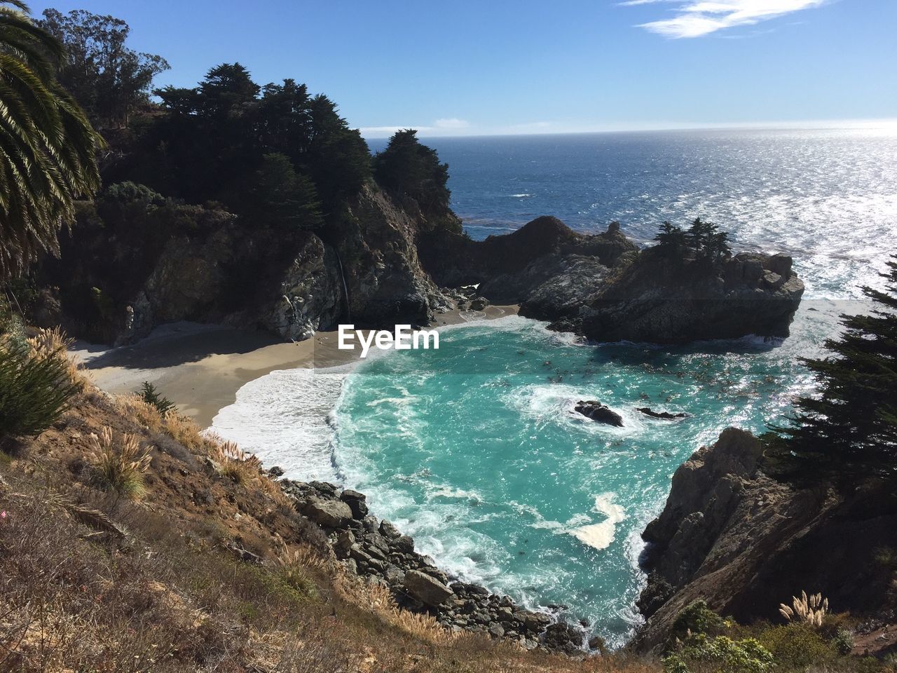 High angle view of rock formations on coast