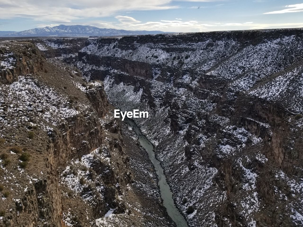 HIGH ANGLE VIEW OF LAND AGAINST THE SKY