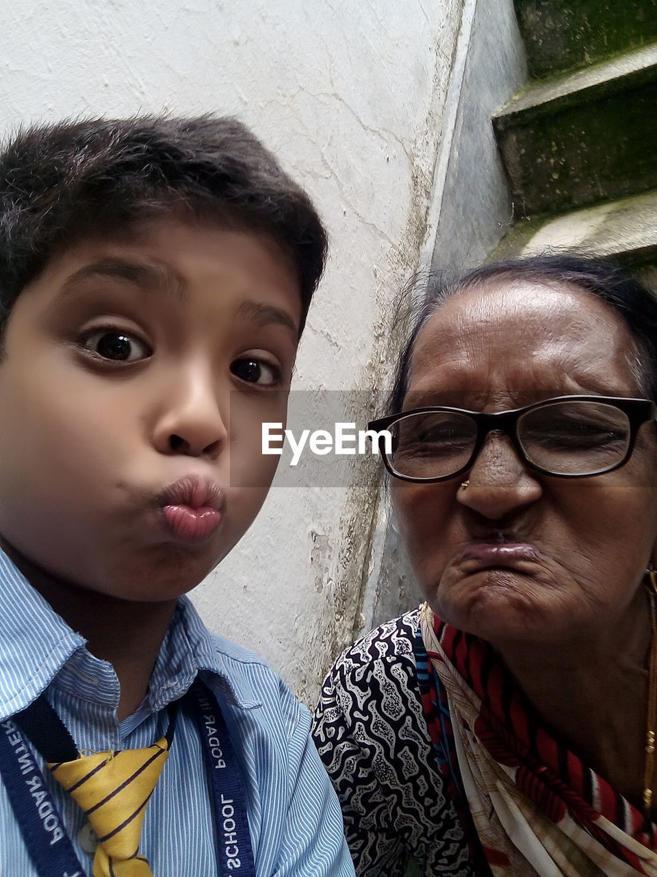 CLOSE-UP PORTRAIT OF BOY WITH EYEGLASSES