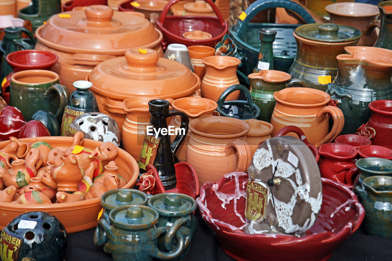 High angle view of handmade earthenware pot containers for sale