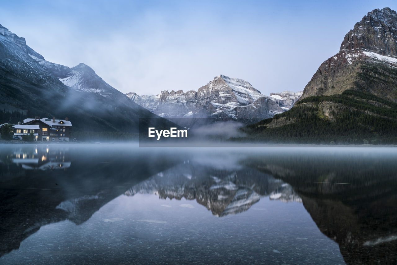 Scenic reflection of rocky mountains in lake