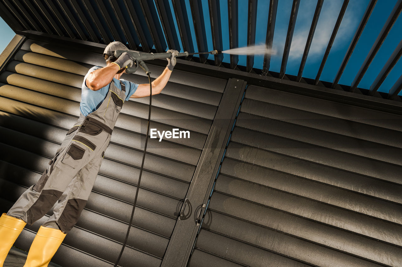 low angle view of man standing on steps