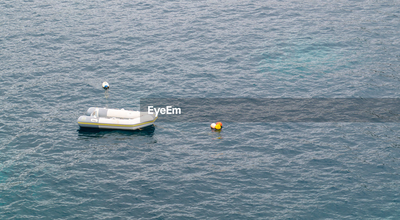 High angle view of boat floating in sea