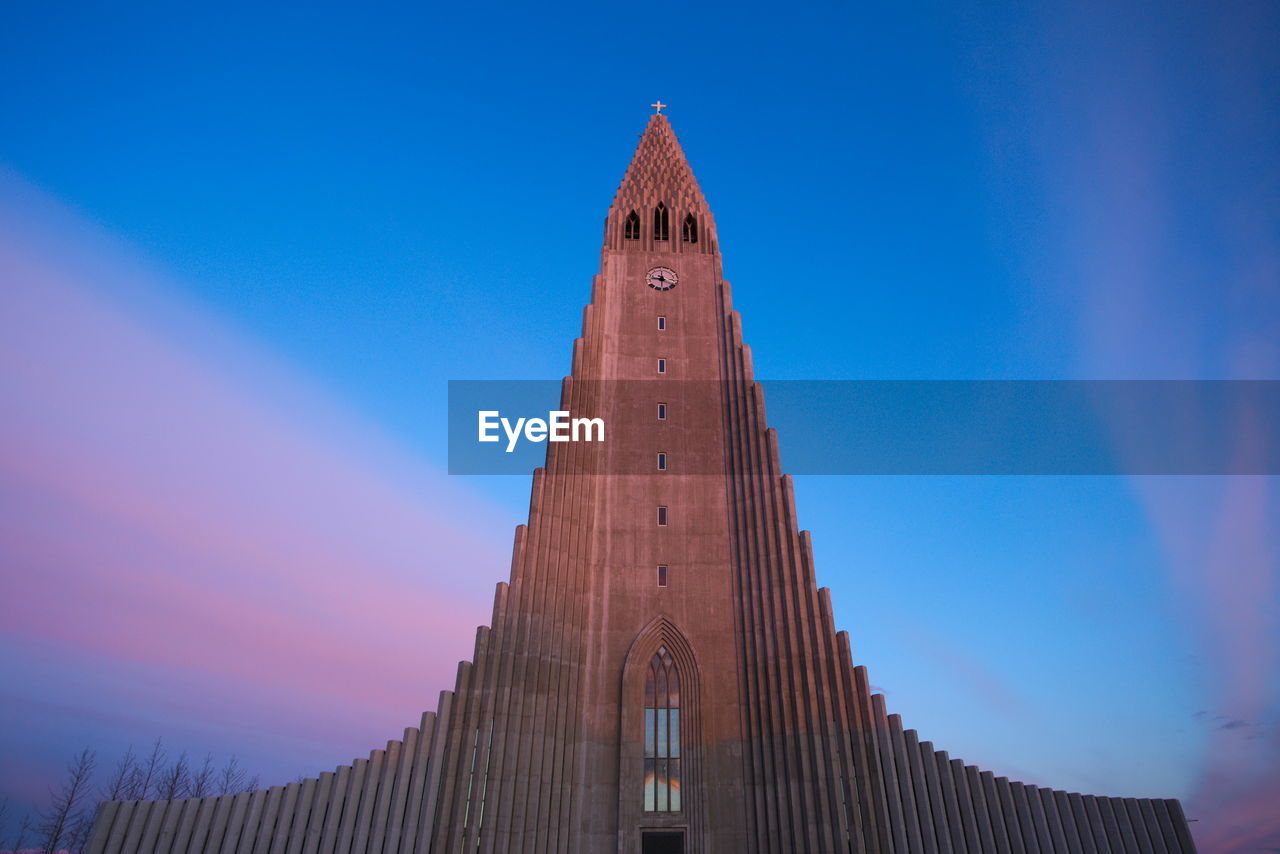 Low angle view of church against clear blue sky