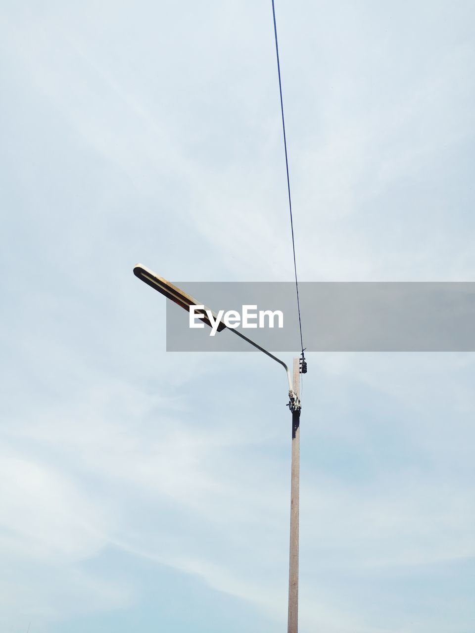 Low angle view of street light against sky