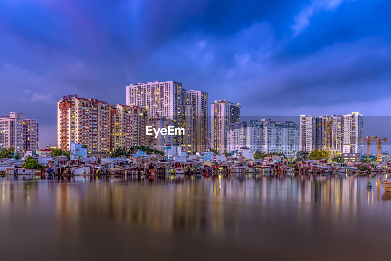 Panoramic view of river and buildings against sky